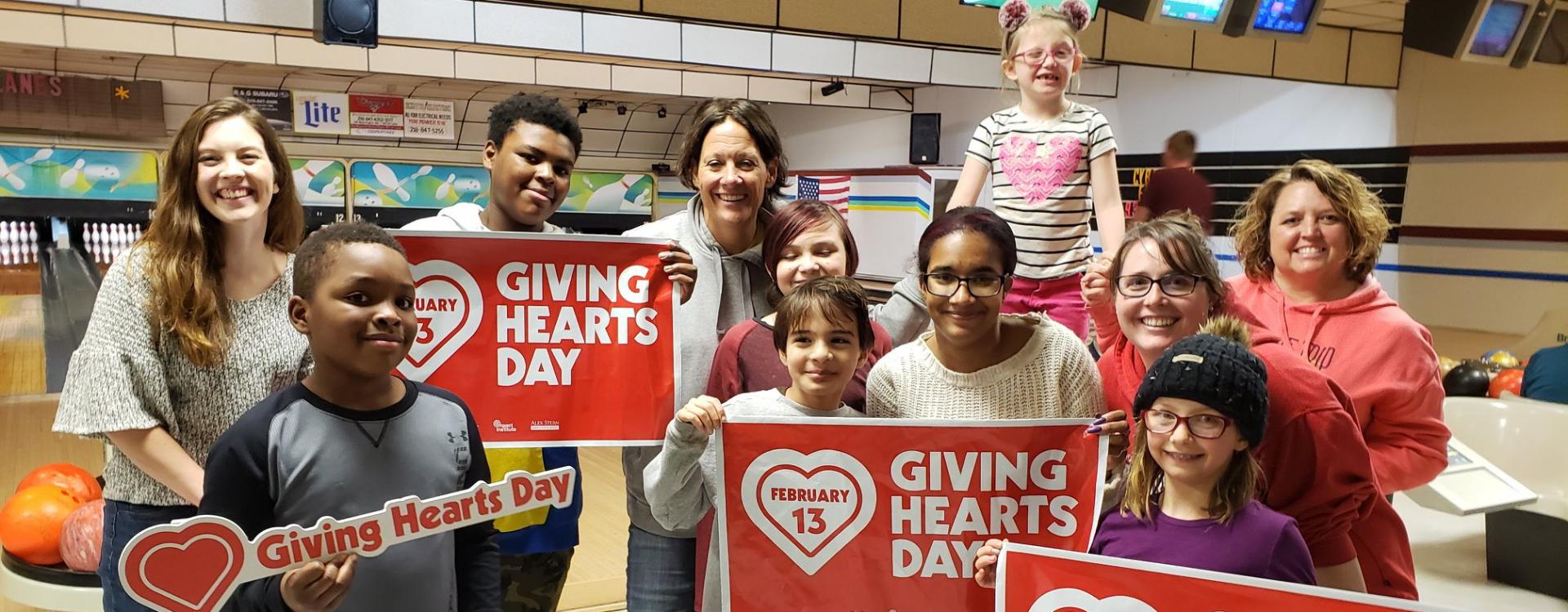 giving hearts day people at bowling alley